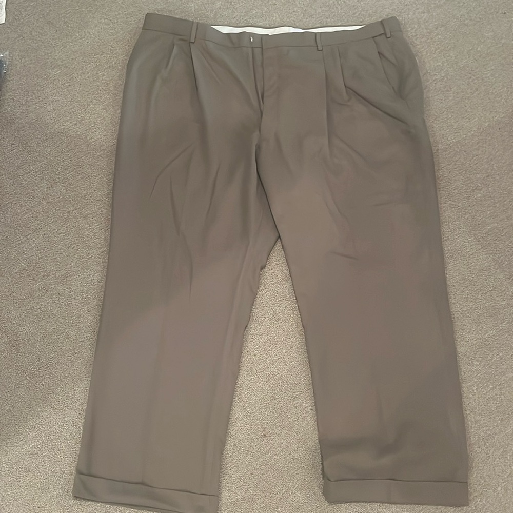 48-30 Men’s Haggar dress slacks. Like new. Pleated front expandable waist. Sand